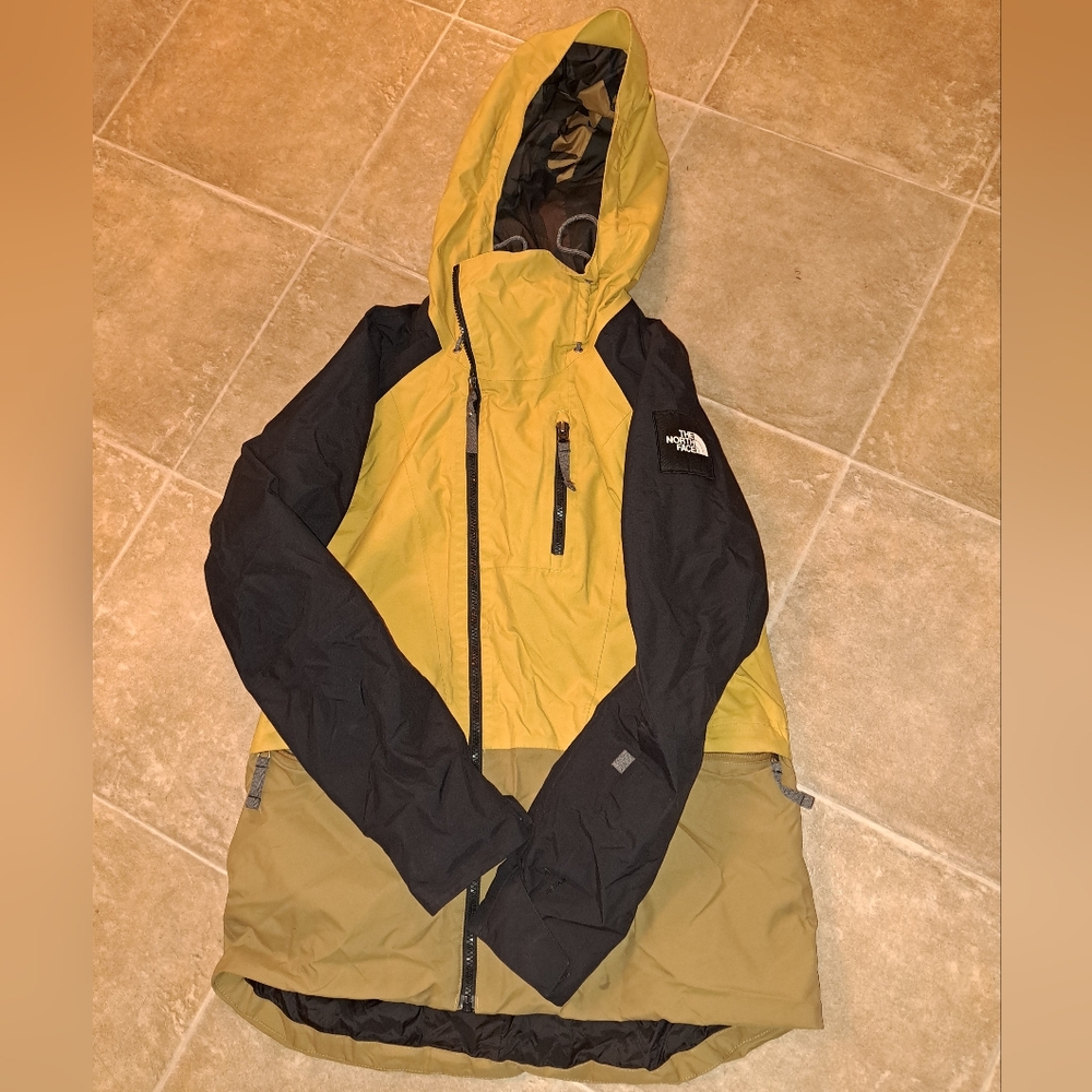The North Face Yellow, Black And Tan Hooded Jacket With Camo Inside.